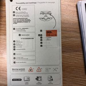 Petzl rock climbing harness with chalk bag